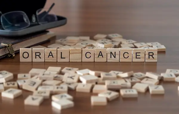 Oral cancer spelled out with game pieces