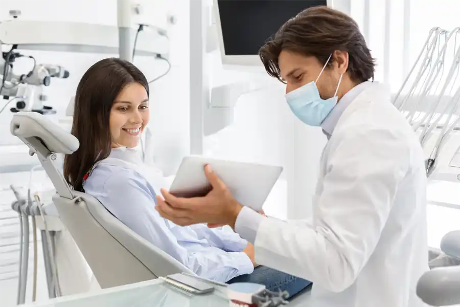 A dentist consulting with a patient 